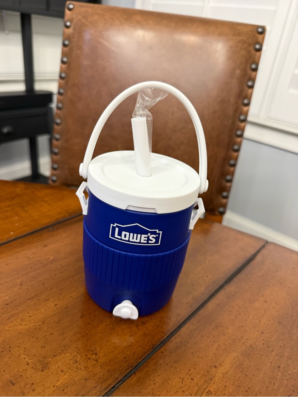 Blue Beverage Cooler Jug with White Lid & Handle cup.
